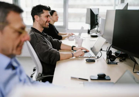 AI Job Impact: Cushy Desks at Risk, Manual Labor Safe